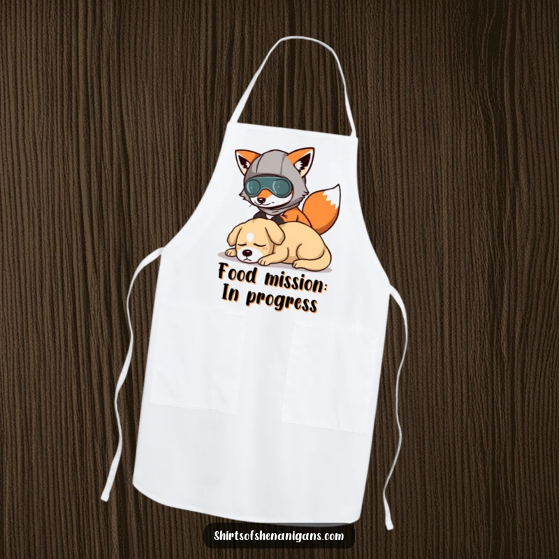 Funny apron with a fox in a disguise, humorously sneaking past a dog, ideal for kitchen fun.