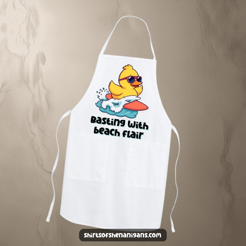 Funny apron featuring a rubber duck in sunglasses surfing a wave, perfect for a fun kitchen experience.