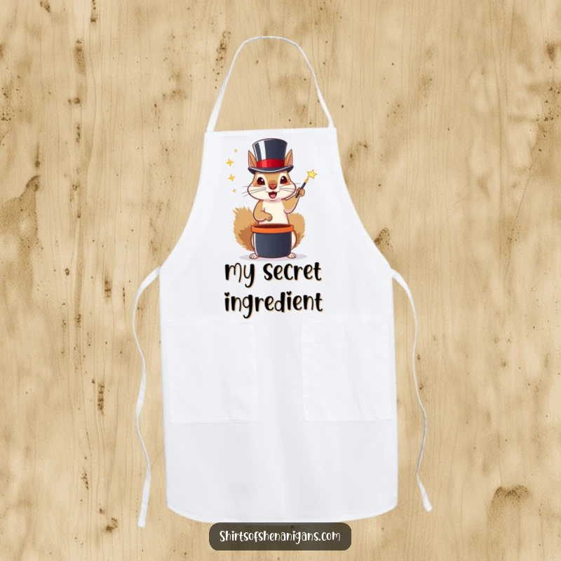 Funny apron featuring a squirrel in a top hat performing magic tricks, perfect for a magical cooking experience.