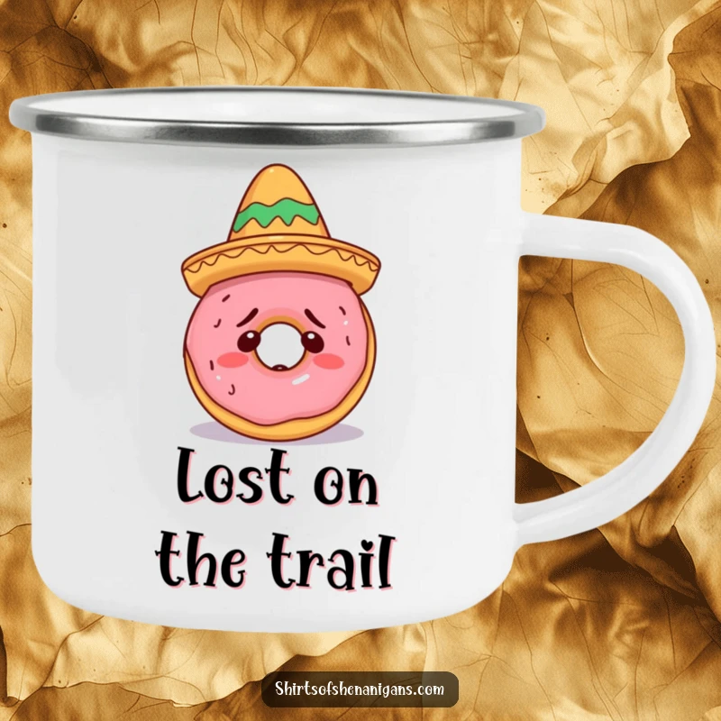 Funny Doughnut Sombrero Camping Mug showing a confused doughnut attempting to wear a small sombrero, perfect for adventures and a funny gift.