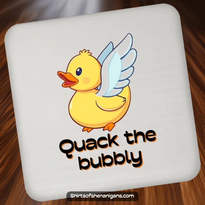 Funny rubber duck with tiny, flapping wings, attempting flight, on a protective drink coaster.