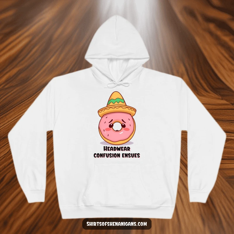 Funny Doughnut Sombrero Hoodie showing a confused doughnut attempting to wear a small sombrero, providing warmth and humor, a funny gift.