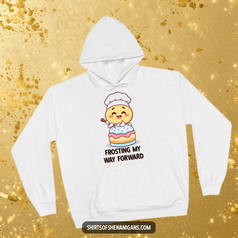 Funny Donut Chef Hoodie: Giggling cartoon donut character frosting a cake, cozy and humorous apparel.