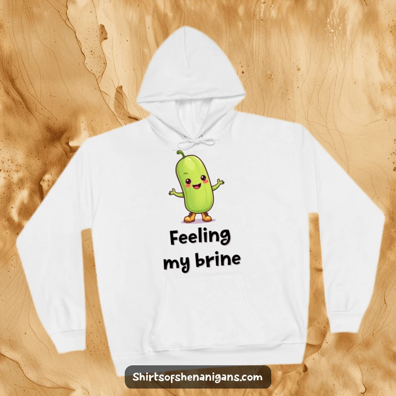 Funny Pickle Hoodie: A dancing pickle wearing tiny boots, embodying joyful movement and fun.
