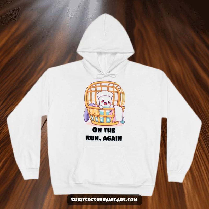 Funny hoodie featuring a giggling sock making a daring escape attempt from a laundry basket.