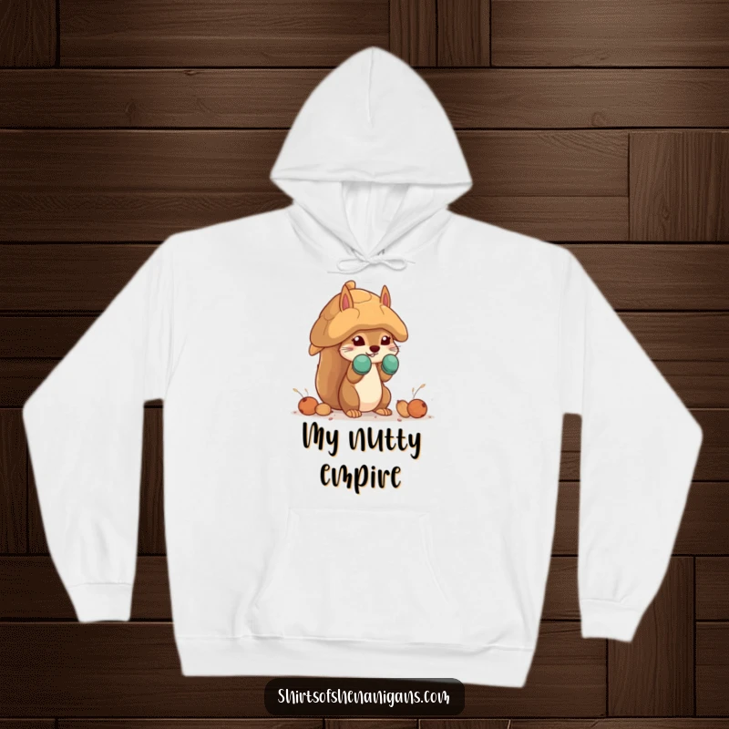 Funny squirrel hoodie featuring a squirrel in mittens building a giant nut house, perfect for warm, humorous comfort.
