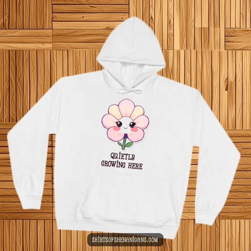 Funny hoodie featuring a shy flower with a bashful, sweet smile, offering warmth and a touch of gentle, endearing humor.