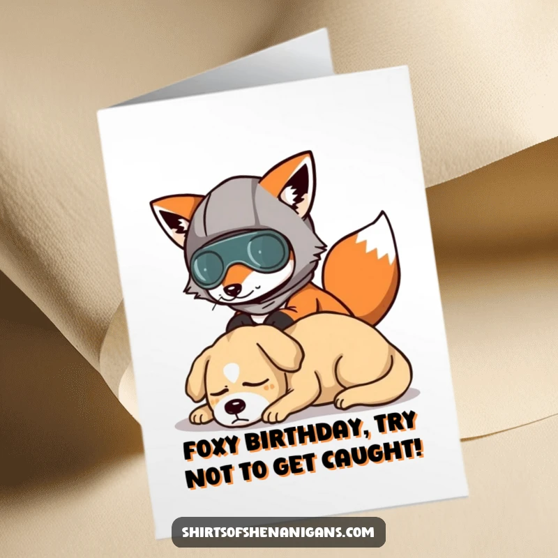 Funny Free Printable Birthday Card: A fox in a silly disguise tries to sneak past a sleeping dog, making a humorous greeting.