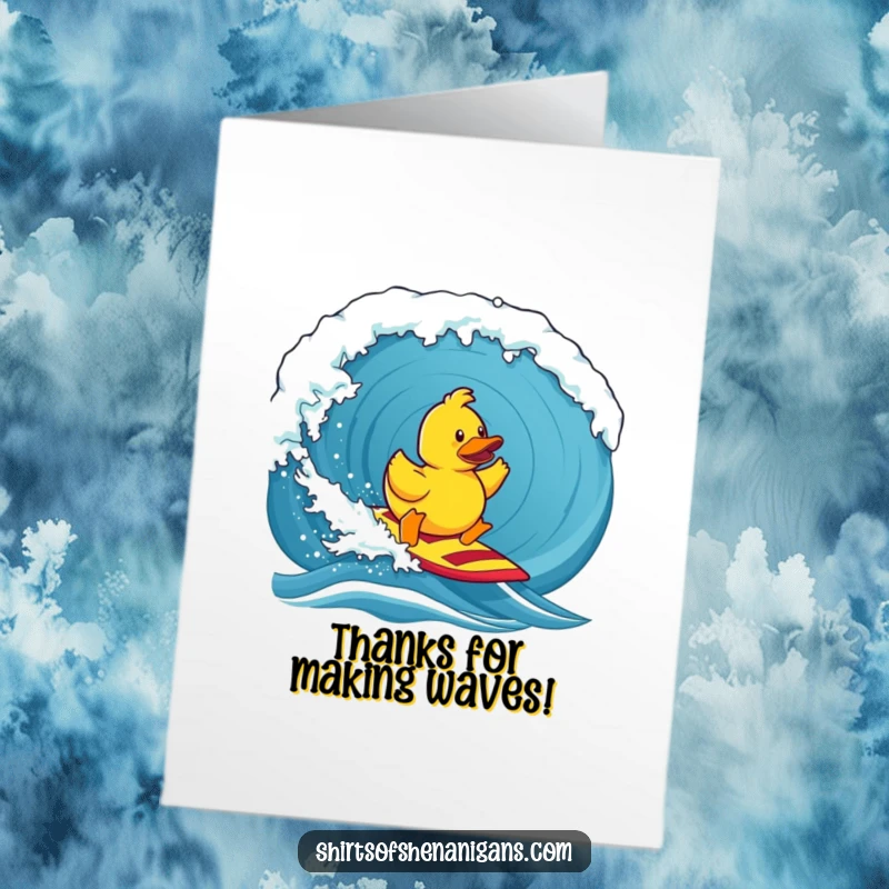 Funny free printable thank you card depicting a cheerful rubber duck mastering a huge ocean wave with a grateful expression.