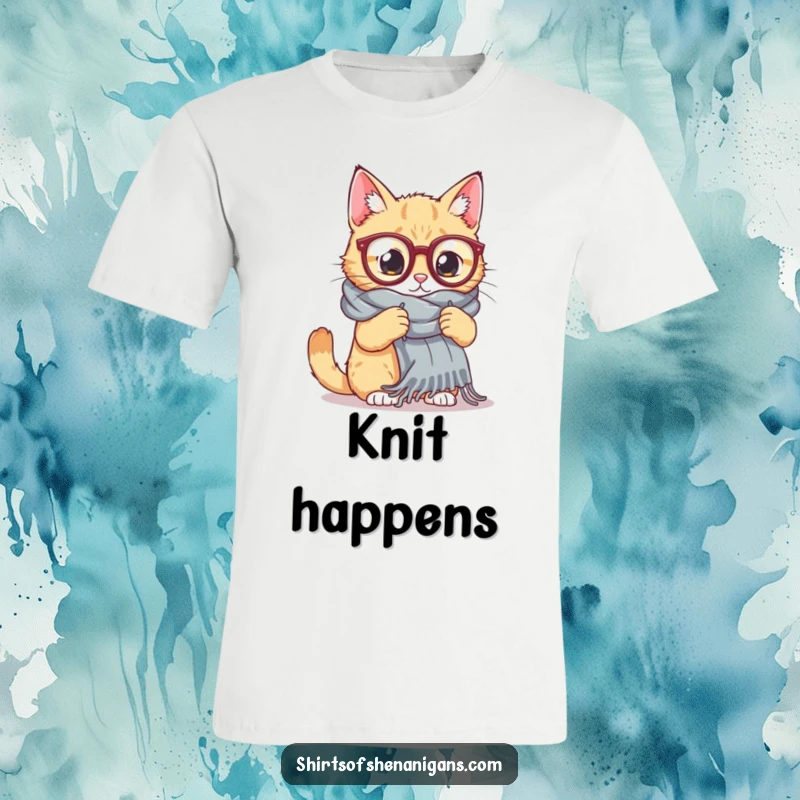 Funny Cat Knitting T-Shirt: A cat wearing oversized glasses attempts to knit a massive scarf, showcasing crafty humor.
