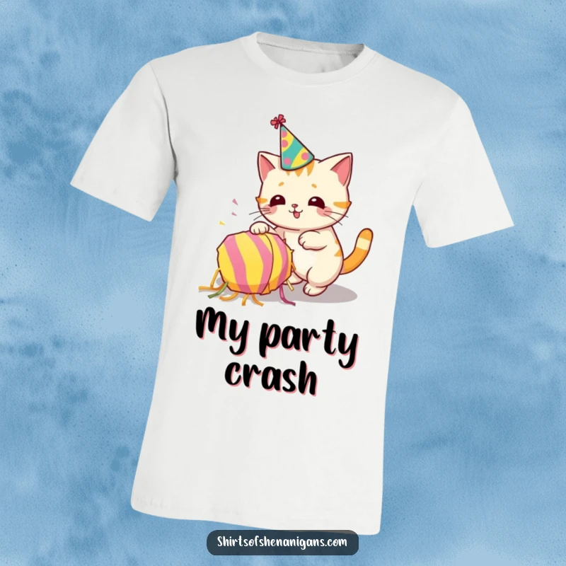 Funny t-shirt featuring a cat in a party hat accidentally toppling a piñata, representing feline party chaos.