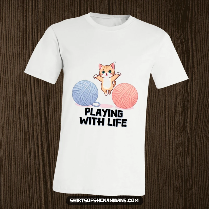 Funny cat t-shirt depicting a sleek cat leaping gracefully between oversized yarn balls, showing agility. A cool funny gift.