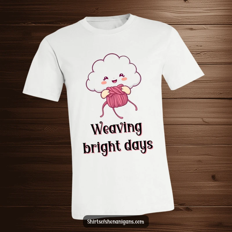 Funny T-Shirt: Cheerful cloud knitting a rainbow, a humorous and creative apparel item.