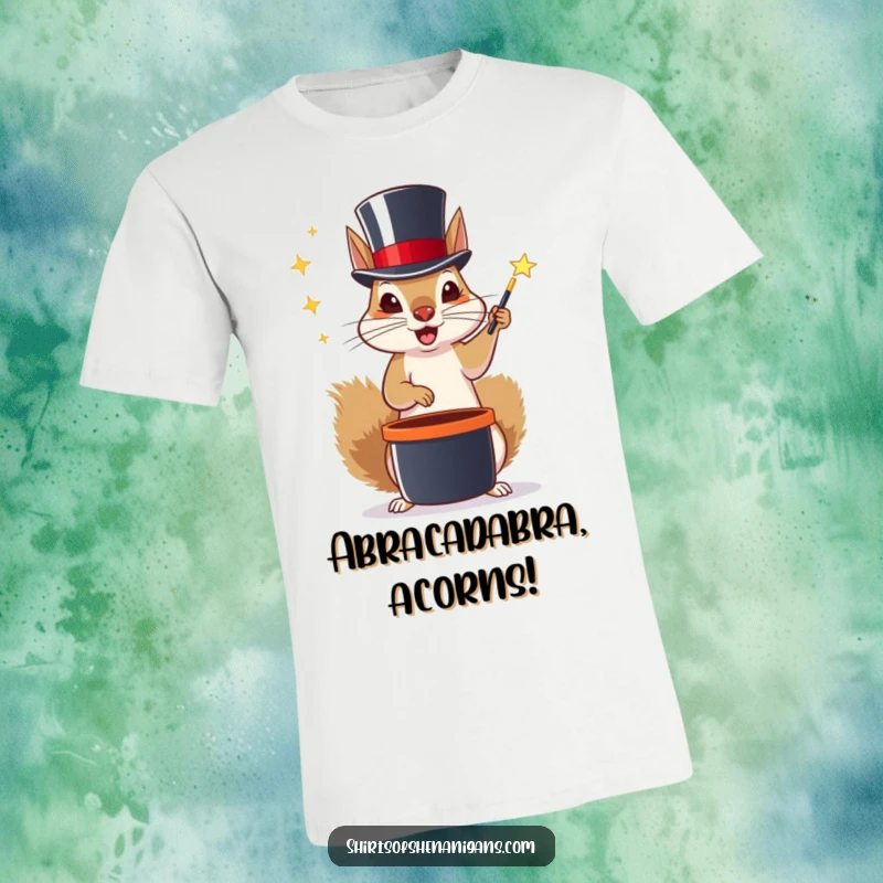 Funny t-shirt depicting a squirrel wearing a top hat, performing a magic trick with acorns, full of playful mischief.