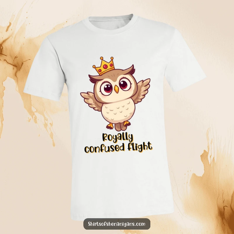 Funny T-shirt showing a surprised owl wearing a small crown, hilariously trying to take flight with a comical expression of effort.