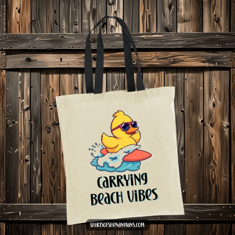 Funny tote bag with a cool rubber duck wearing sunglasses, surfing a wave, perfect for beach day essentials.