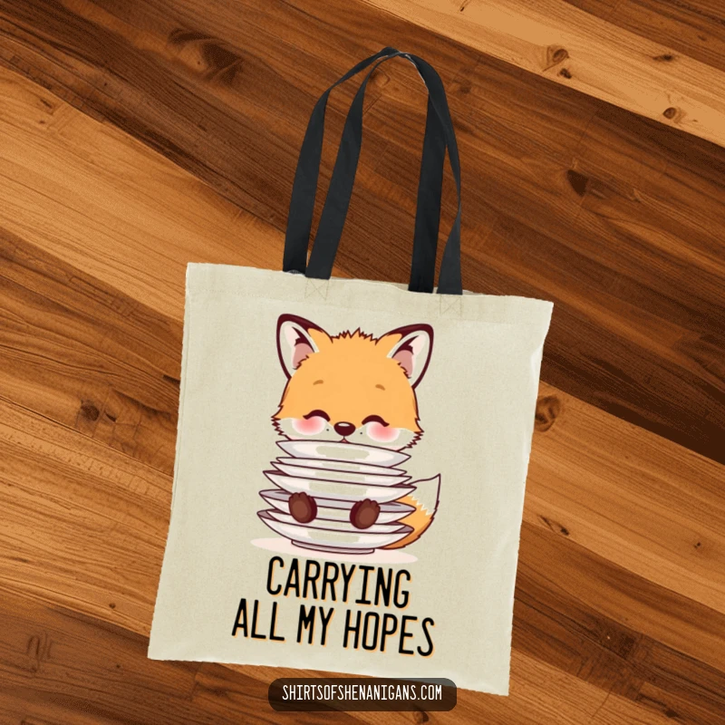 Funny Tote Bag: A cute fox cub balancing a stack of plates on its nose, a charming and practical accessory for animal enthusiasts.