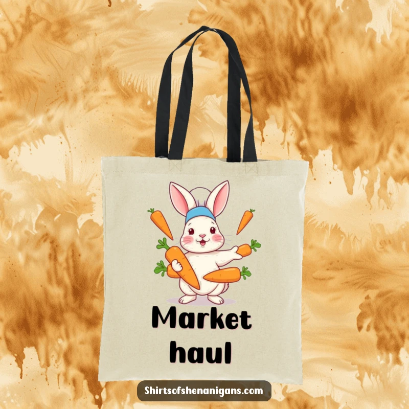 Funny tote bag showcasing a rabbit in a chef hat hilariously juggling oversized carrots, perfect for grocery runs and kitchen adventures.
